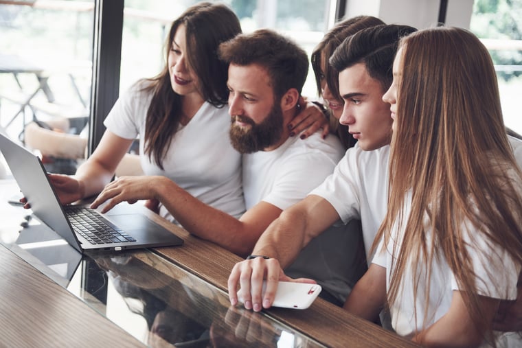 a-group-of-young-people-with-gadgets-and-a-laptop-2021-08-29-16-58-08-utc