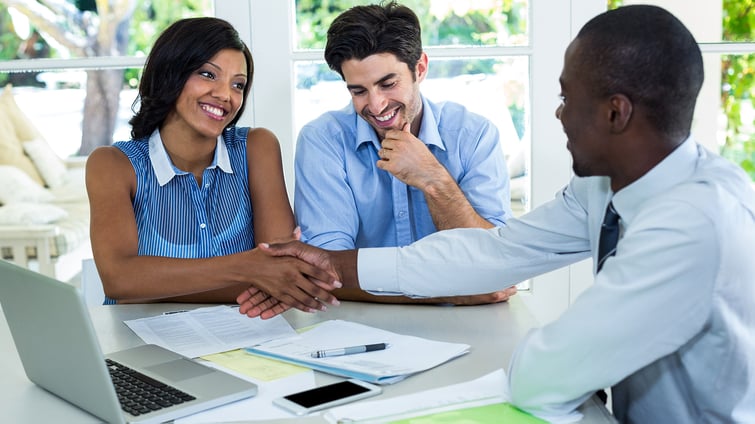 happy-couple-shaking-hands-with-real-estate-agent-2021-08-28-22-11-22-utc